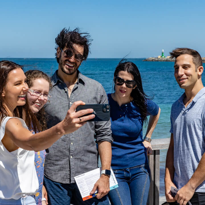 Team smiling and taking a photo in Fremantle after finishing the amazing race