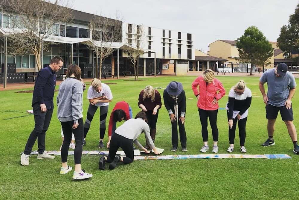 Team doing team building for teachers and support staff outside